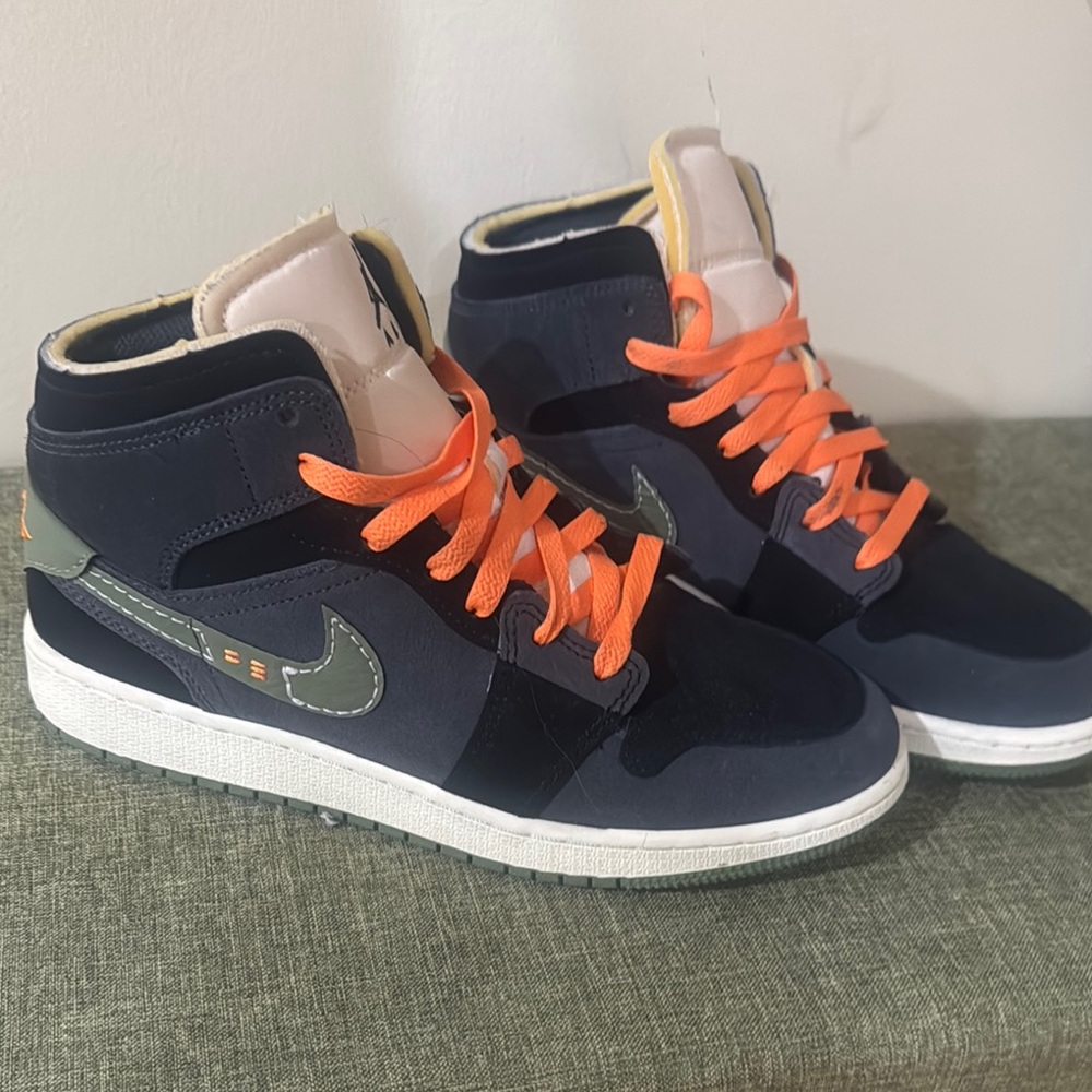 Stylish High-Top Sneakers with Orange Laces